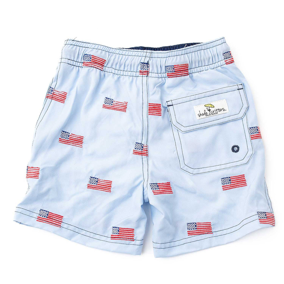 Boys Americana swim trunks with back pocket detail and embroidered icons, trendy kids swimwear.