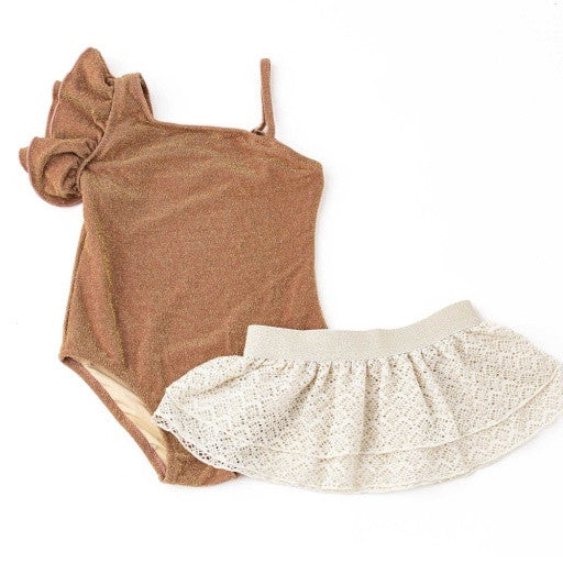 Shade Critters Shimmer Mocha Girls One Shoulder One Piece & Crochet Skirt Set shown laid flat, highlighting the metallic mocha swimsuit and soft crochet skirt with shimmery waistband.