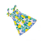 Girls citrus print smocked dress with tie shoulder straps and flowy silhouette, bright kids summer outfit.