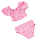 Girls pink eyelet two piece swimsuit with puff sleeve top and coordinating bottoms, soft textured kids swimwear.