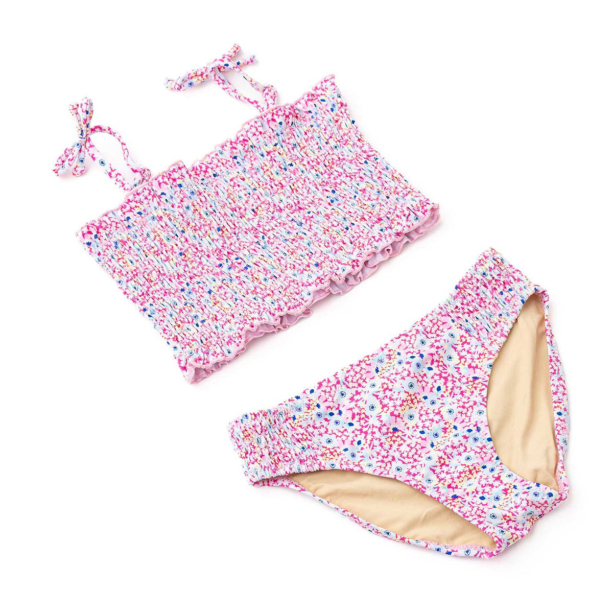 Girls floral smocked bikini in bright daisy print with adjustable tie straps and soft stretch fabric, stylish kids two piece swimsuit.
