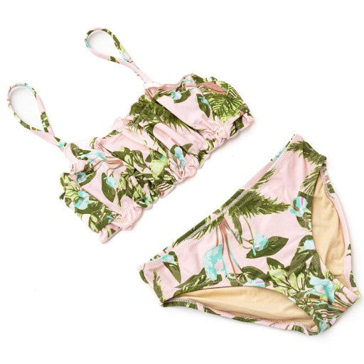 Full front flat lay of the Shade Critters two-piece set displaying the vibrant tropical foliage print across both pieces.