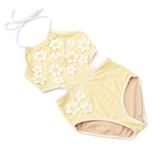 Angled view of Butter Yellow Daisy girls one piece swimsuit highlighting 3D daisy detail.