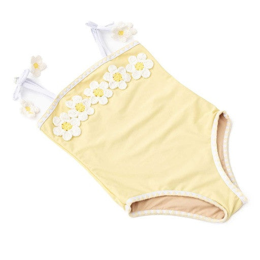 Front view of Butter Daisy girls one piece swimsuit with daisy garland neckline and bow straps.
