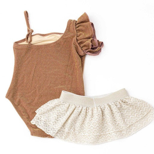 Back view of the Shade Critters Shimmer Mocha one-shoulder swimsuit and crochet skirt, showing the asymmetrical strap and easy pull-on skirt styling.