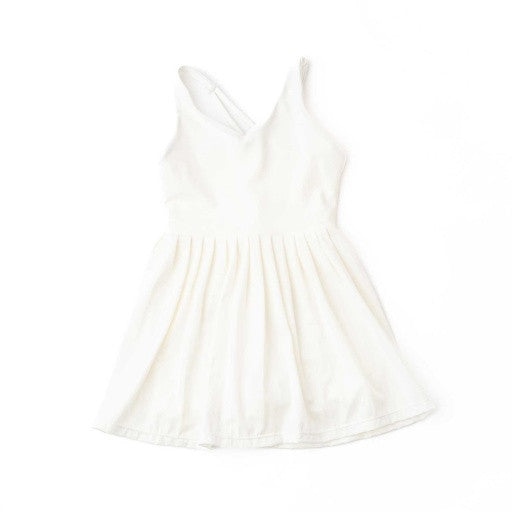 Shade Critters front view: The active dress in crisp white, showing the smooth bodice and pleated skirt.
