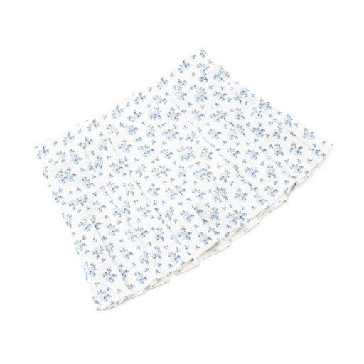 Detail View: A close look at the pleats and floral print on the Shade Critters active skirt.I