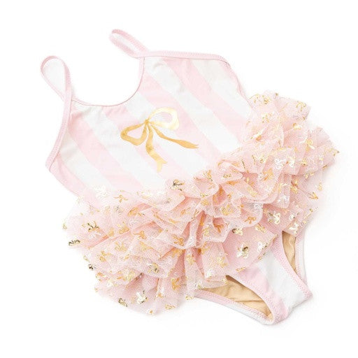 Close-up of blush stripe girls skirted one piece swimsuit highlighting layered tulle and gold bow detail.