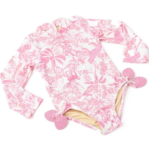Angled view of Pink Paradise girls long sleeve one piece swimsuit highlighting safari floral artwork.